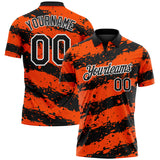 Custom Black Orange-White Paint Splash Stripe Performance Polo Shirt