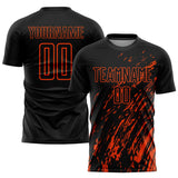 Custom Black Orange Splash Sublimation Soccer Uniform Jersey